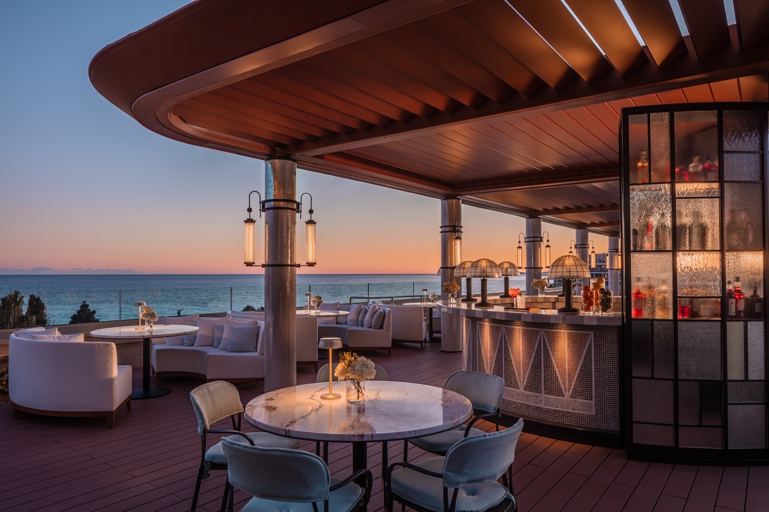 The hotel's rooftop hotel and bar offer panoramic Bais des Anges views